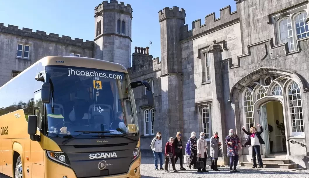 Coach outside stately home